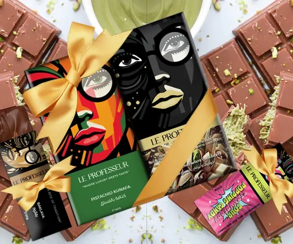 Le Professeur luxury chocolate gift set with artistic packaging, golden ribbons, and pistachio chocolate bars.
