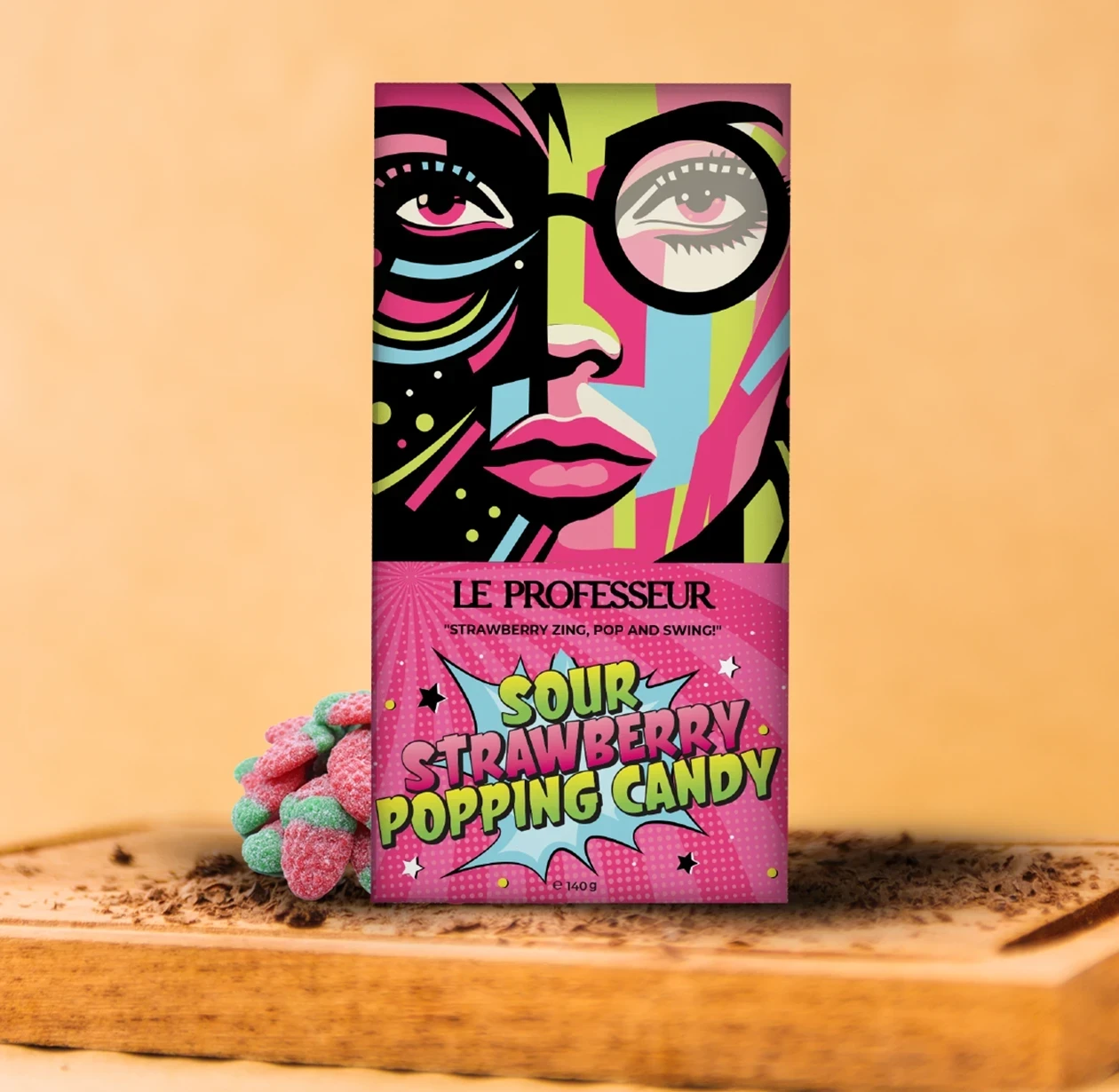 Le Professeur Sour Strawberry Popping Candy bar with colorful pop-art design and candy pieces.