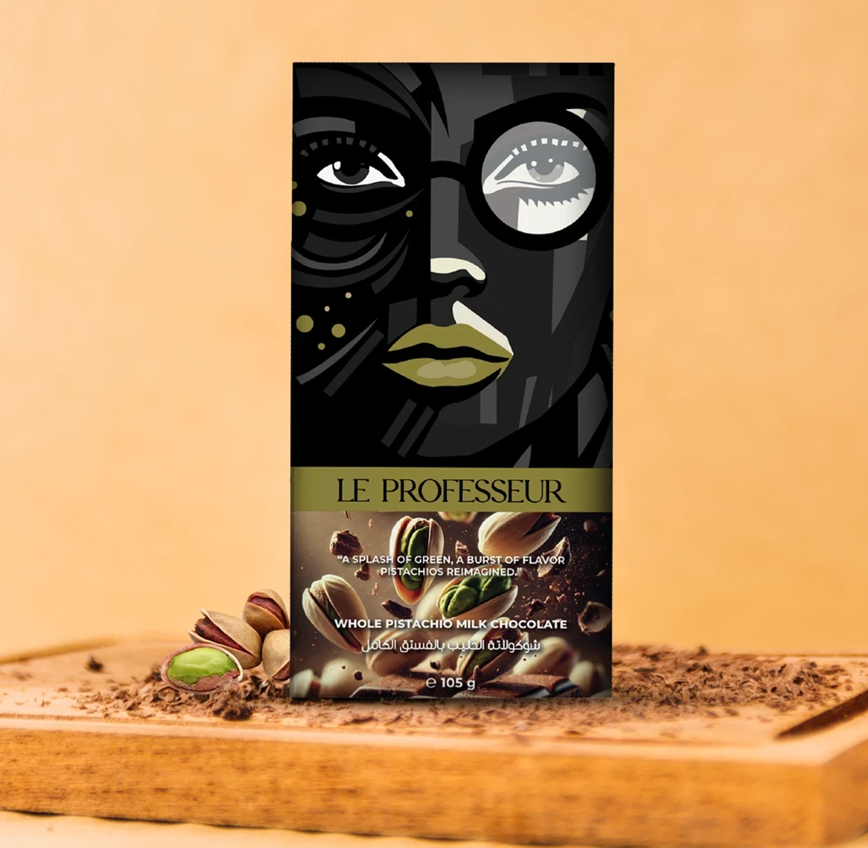 Le Professeur Whole Pistachio Milk Chocolate Bar with artistic face design packaging.