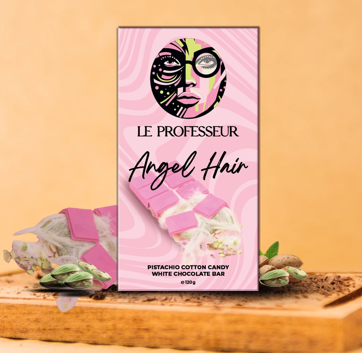 Le Professeur Angel Hair Pistachio Cotton Candy White Chocolate Bar in pink artistic packaging with cotton candy and pistachios.
