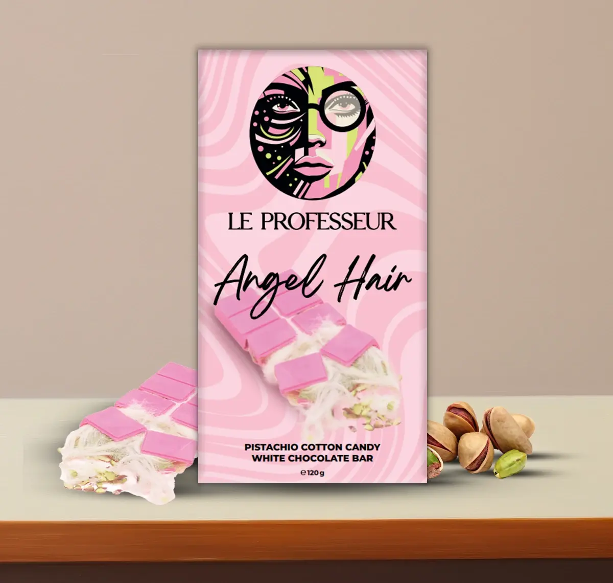 Le Professeur Angel Hair bar featuring pistachio cotton candy and white chocolate with elegant pink packaging.